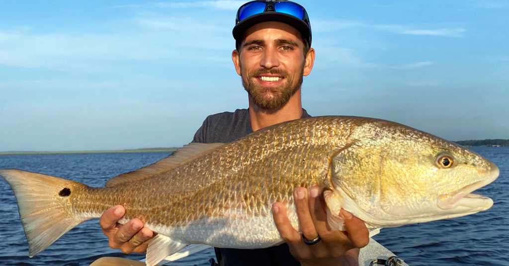 slam shady bomber redfish in dark water